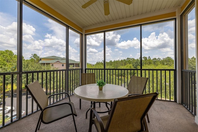 9055 Treasure Trove Ln Unit 409, Kissimmee, FL 34747 - sunroom with a ceiling fan and outdoor dining area