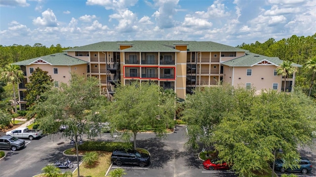 9055 Treasure Trove Ln Unit 409, Kissimmee, FL 34747 - view of apartment building / complex with uncovered parking