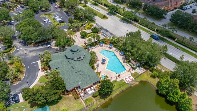 9055 Treasure Trove Ln Unit 409, Kissimmee, FL 34747 - aerial view of property's location featuring a pool and a large body of water