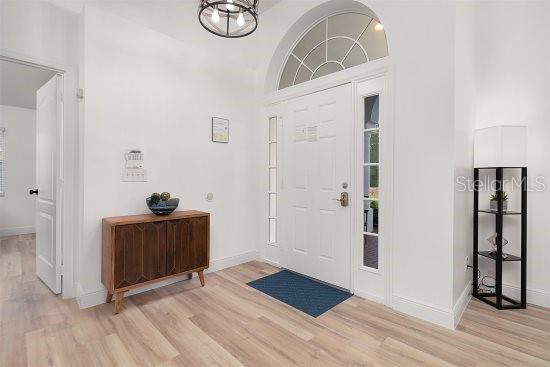 252 Barbera Dr, Davenport, FL 33897 - entrance foyer with wood finished floors and baseboards