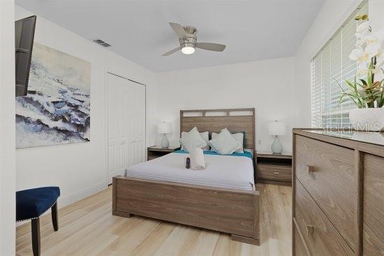252 Barbera Dr, Davenport, FL 33897 - bedroom featuring light wood-style floors, a ceiling fan, and baseboards