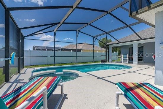 252 Barbera Dr, Davenport, FL 33897 - view of swimming pool with a patio, a lanai, and a pool with connected hot tub