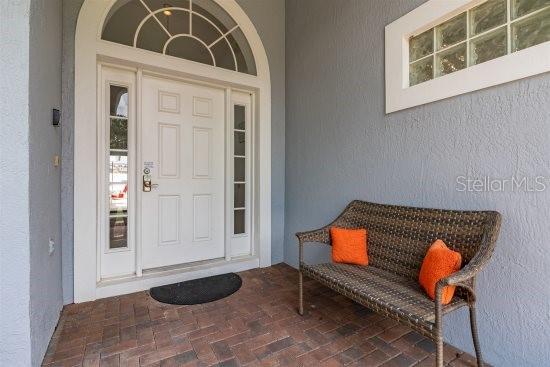 252 Barbera Dr, Davenport, FL 33897 - doorway to property with stucco siding