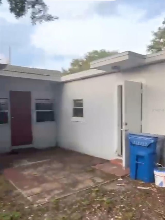 380 S Echo Dr, Lake Alfred, FL 33850 - view of side of home with stucco siding
