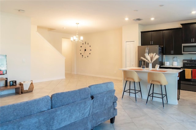 11378 Whistling Pine Way, Orlando, FL 32832 - living area featuring a chandelier, light tile patterned floors, recessed lighting, and baseboards