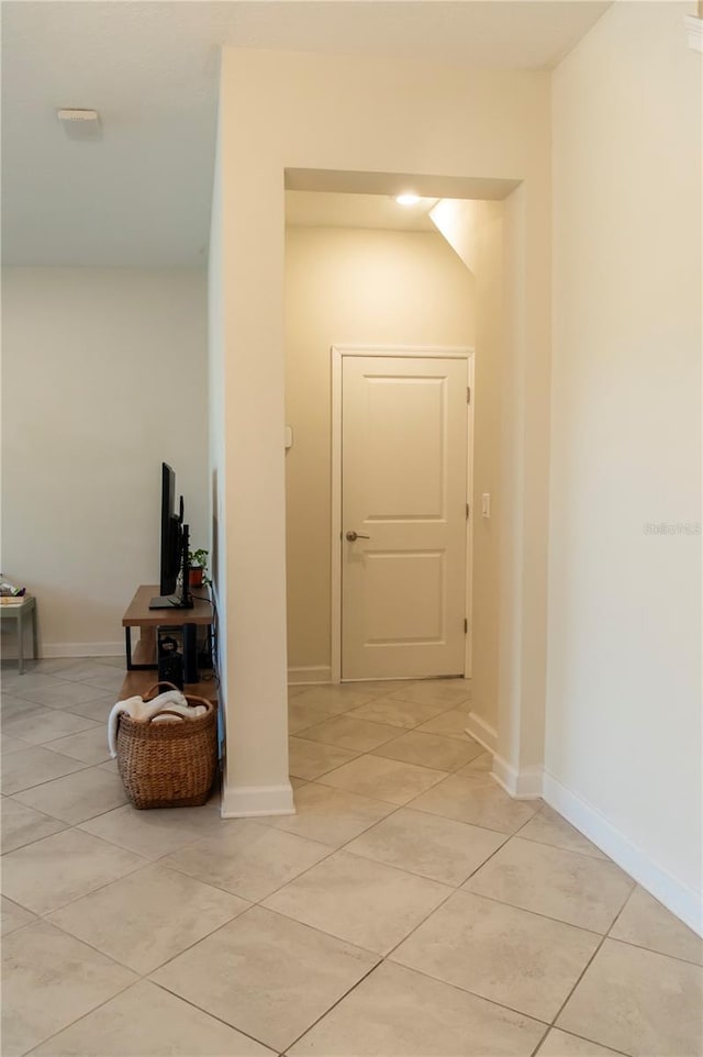 11378 Whistling Pine Way, Orlando, FL 32832 - hallway with light tile patterned floors and baseboards