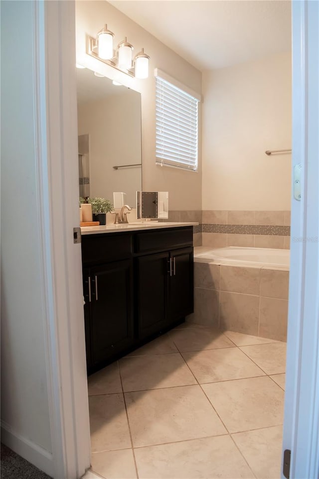 11378 Whistling Pine Way, Orlando, FL 32832 - full bathroom with vanity, a bath, and tile patterned floors