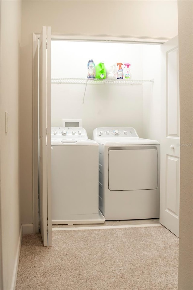 11378 Whistling Pine Way, Orlando, FL 32832 - washroom with washer and clothes dryer and carpet floors