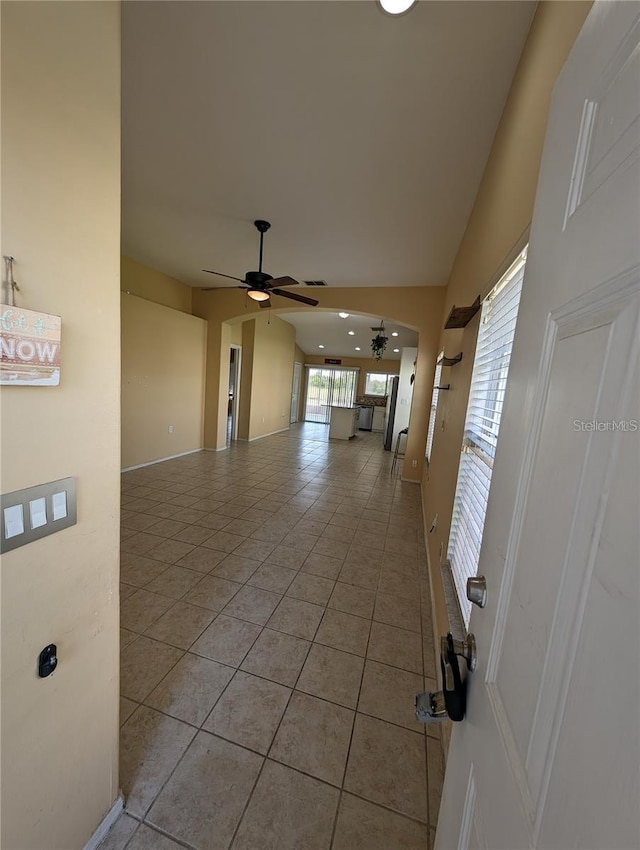 13940 Corrine Key Pl, Orlando, FL 32824 - corridor featuring light tile patterned floors and baseboards