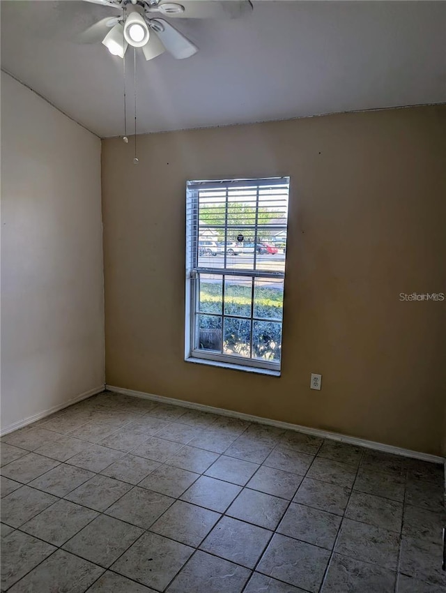 13940 Corrine Key Pl, Orlando, FL 32824 - empty room with light tile patterned flooring, a ceiling fan, and baseboards