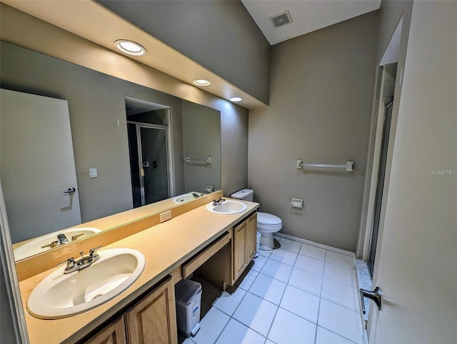 13940 Corrine Key Pl, Orlando, FL 32824 - bathroom with a shower stall, toilet, double vanity, tile patterned flooring, and baseboards