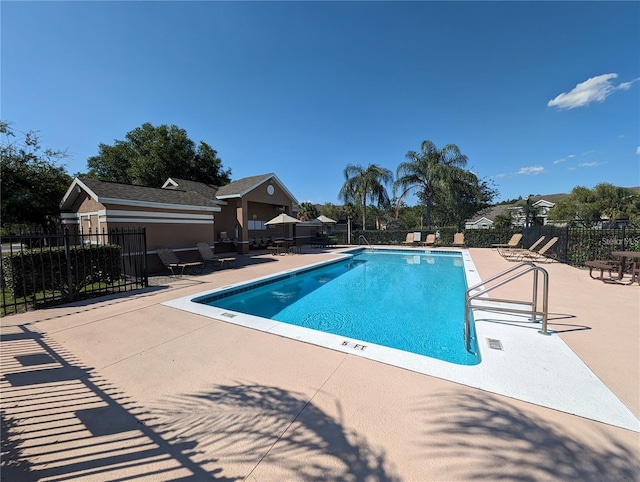 13940 Corrine Key Pl, Orlando, FL 32824 - community pool featuring a patio area