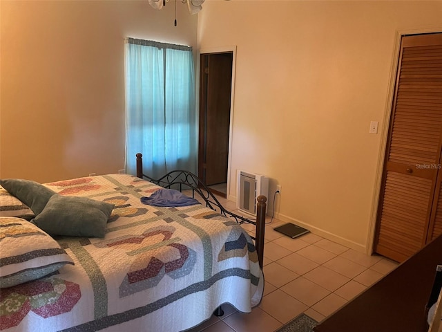 4926 Reginald Rd, Orlando, FL 32829 - bedroom with light tile patterned floors, a closet, and baseboards