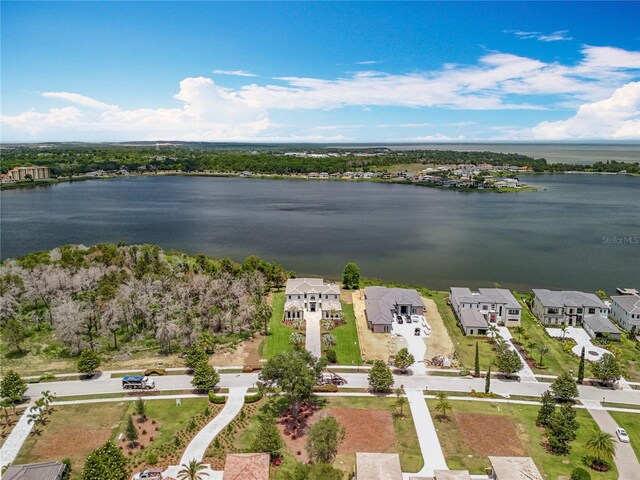 15121 Pendio Dr, Montverde, FL 34756 - aerial view of residential area featuring a nearby body of water