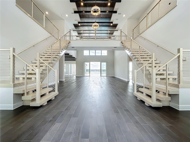 15121 Pendio Dr, Montverde, FL 34756 - stairway with a towering ceiling, baseboards, wood finished floors, and recessed lighting