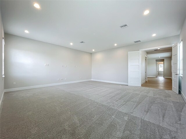15121 Pendio Dr, Montverde, FL 34756 - carpeted empty room with recessed lighting and baseboards