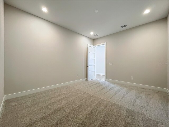 15121 Pendio Dr, Montverde, FL 34756 - unfurnished room with baseboards, light colored carpet, and recessed lighting