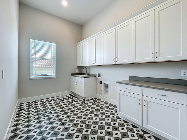 15121 Pendio Dr, Montverde, FL 34756 - laundry room with cabinet space, baseboards, and hookup for a washing machine