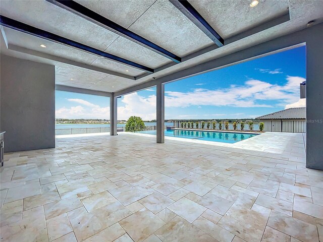 15121 Pendio Dr, Montverde, FL 34756 - view of swimming pool featuring a patio and a water view