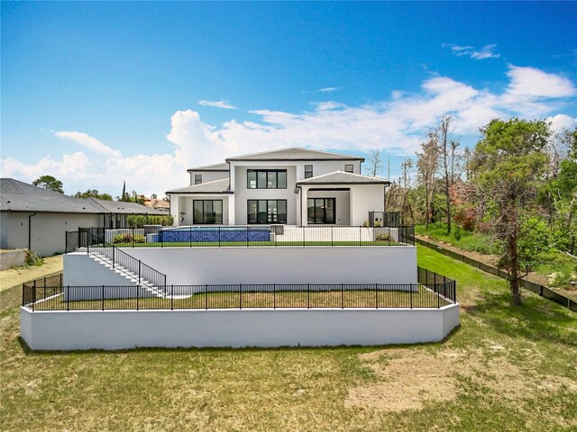 15121 Pendio Dr, Montverde, FL 34756 - rear view of house with stucco siding