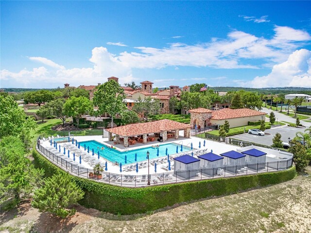 15121 Pendio Dr, Montverde, FL 34756 - community pool with a patio