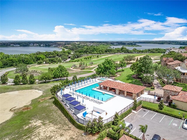 15121 Pendio Dr, Montverde, FL 34756 - drone / aerial view of a nearby body of water, a golf club, and a pool