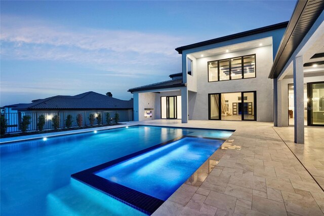15121 Pendio Dr, Montverde, FL 34756 - view of pool featuring a pool with connected hot tub and a patio