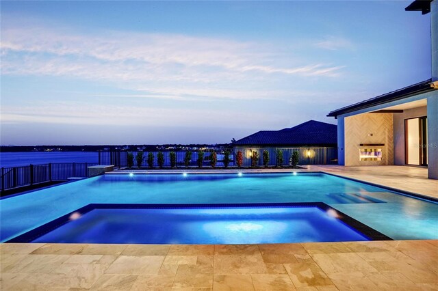15121 Pendio Dr, Montverde, FL 34756 - view of swimming pool with a patio area and a pool with connected hot tub
