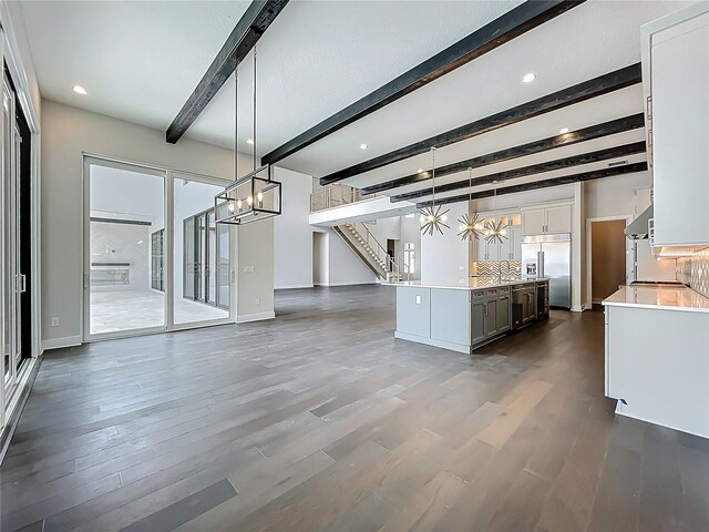 15121 Pendio Dr, Montverde, FL 34756 - kitchen featuring a chandelier, stainless steel built in fridge, beam ceiling, light countertops, and baseboards