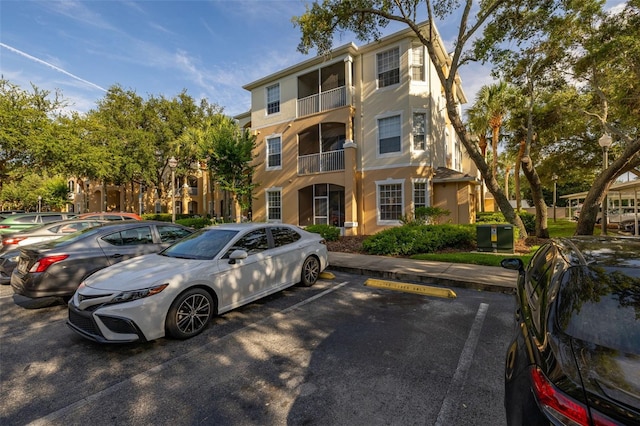6214 Stevenson Dr Unit 106, Orlando, FL 32835 - view of building exterior with uncovered parking