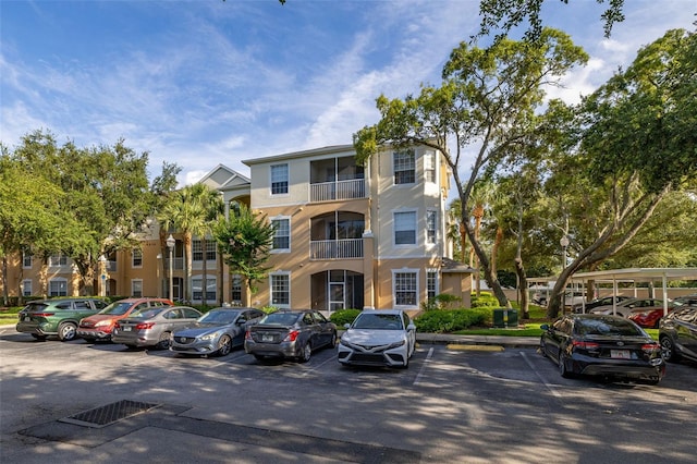 6214 Stevenson Dr Unit 106, Orlando, FL 32835 - view of apartment building / complex featuring uncovered parking