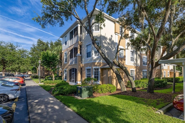 6214 Stevenson Dr Unit 106, Orlando, FL 32835 - view of building exterior with uncovered parking