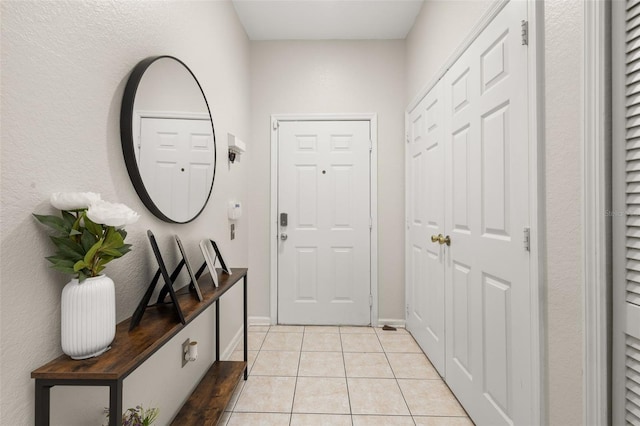 6214 Stevenson Dr Unit 106, Orlando, FL 32835 - doorway with light tile patterned flooring and baseboards