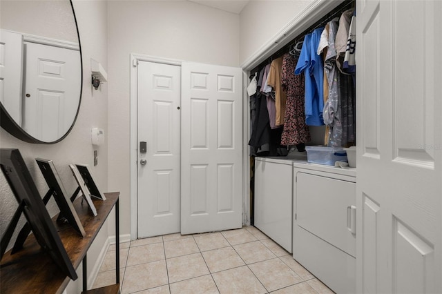 6214 Stevenson Dr Unit 106, Orlando, FL 32835 - washroom featuring separate washer and dryer and light tile patterned flooring