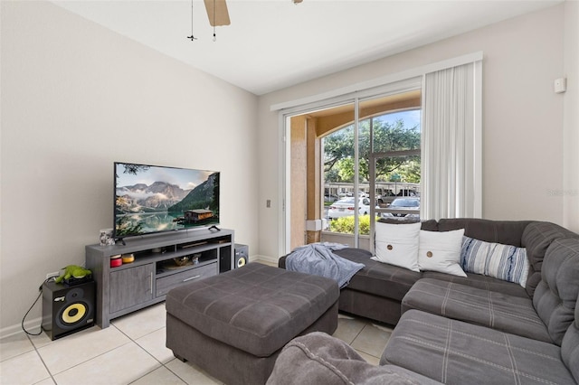 6214 Stevenson Dr Unit 106, Orlando, FL 32835 - living room with light tile patterned floors, a ceiling fan, and baseboards