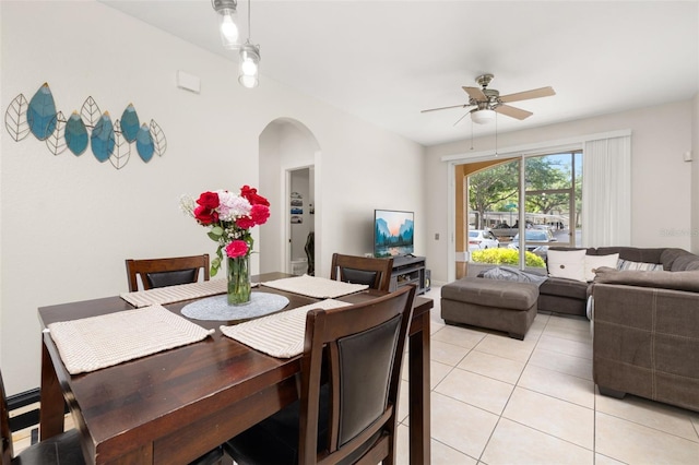 6214 Stevenson Dr Unit 106, Orlando, FL 32835 - dining room with arched walkways, ceiling fan, and light tile patterned floors