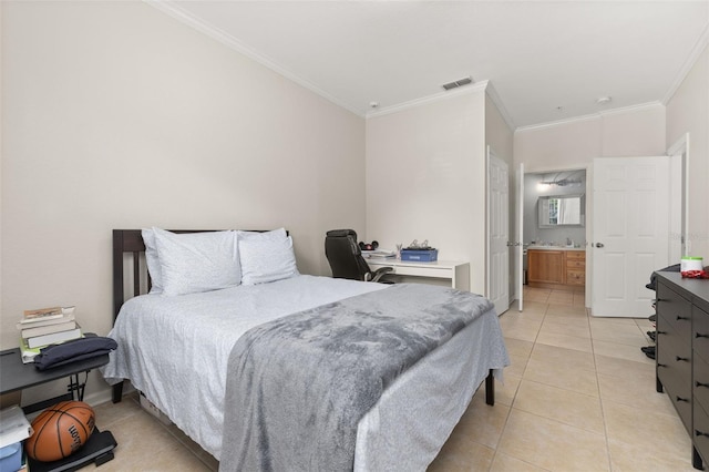 6214 Stevenson Dr Unit 106, Orlando, FL 32835 - bedroom with ornamental molding, light tile patterned flooring, ensuite bathroom, and a desk