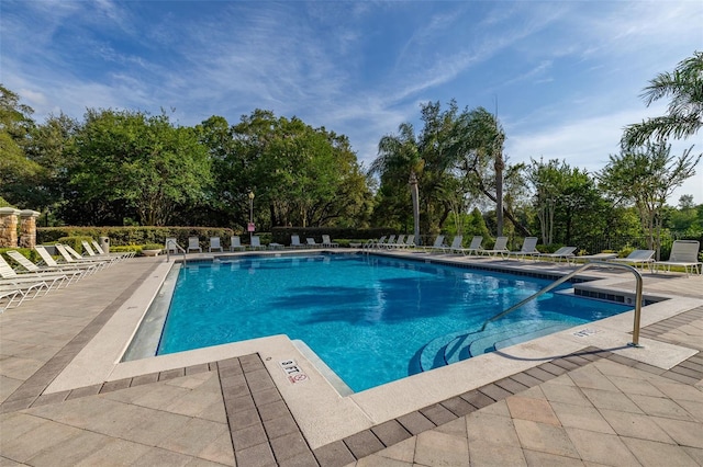 6214 Stevenson Dr Unit 106, Orlando, FL 32835 - community pool featuring a patio area and view of scattered trees