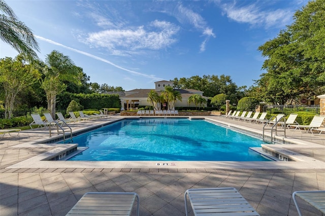 6214 Stevenson Dr Unit 106, Orlando, FL 32835 - community pool featuring a patio area and view of wooded area