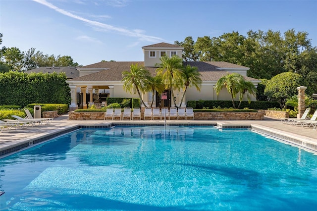 6214 Stevenson Dr Unit 106, Orlando, FL 32835 - community pool featuring a patio area