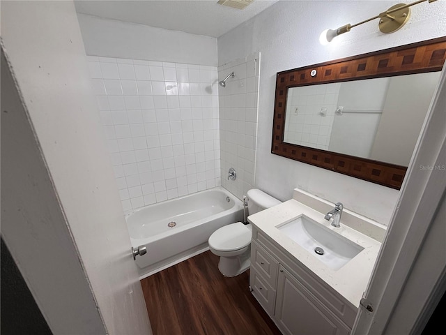 709 Orchid Dr, Davenport, FL 33897 - full bath featuring toilet, shower / washtub combination, vanity, and wood finished floors