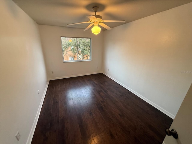 709 Orchid Dr, Davenport, FL 33897 - unfurnished room with ceiling fan, dark wood-style floors, and baseboards