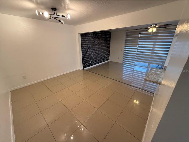 709 Orchid Dr, Davenport, FL 33897 - tiled empty room featuring a chandelier, a ceiling fan, and a textured ceiling