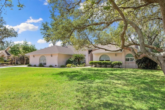 7222 Stanford Dr, Lakeland, FL 33809 - view of front of property featuring stucco siding and a front yard