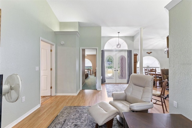 7222 Stanford Dr, Lakeland, FL 33809 - foyer entrance with light wood-style floors, french doors, and baseboards