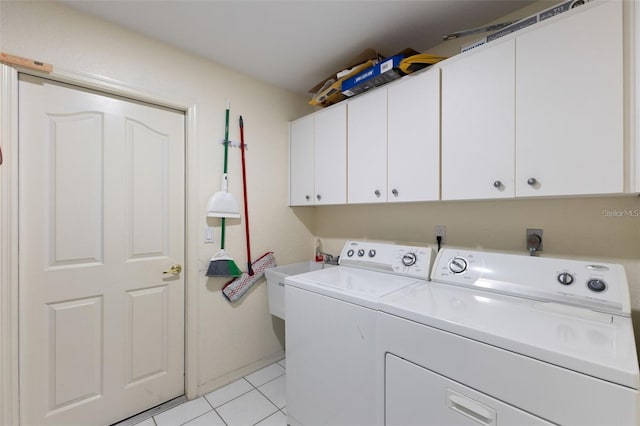 7222 Stanford Dr, Lakeland, FL 33809 - laundry area with cabinet space, separate washer and dryer, and light tile patterned floors