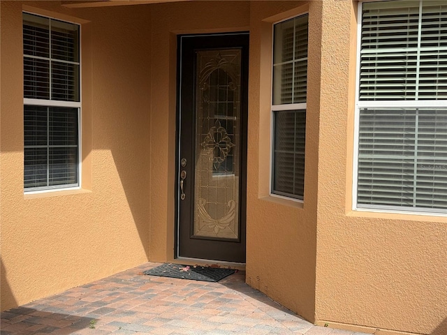 2495 Palm Tree Dr, Kissimmee, FL 34759 - entrance to property with stucco siding