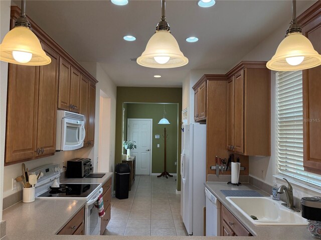 2495 Palm Tree Dr, Kissimmee, FL 34759 - kitchen with white appliances, a sink, light tile patterned floors, brown cabinets, and recessed lighting