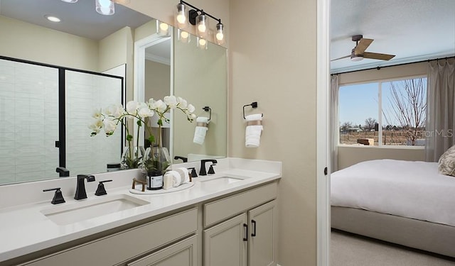 9021 Players Dr, Weeki Wachee, FL 34613 - ensuite bathroom with double vanity, a ceiling fan, and tiled shower