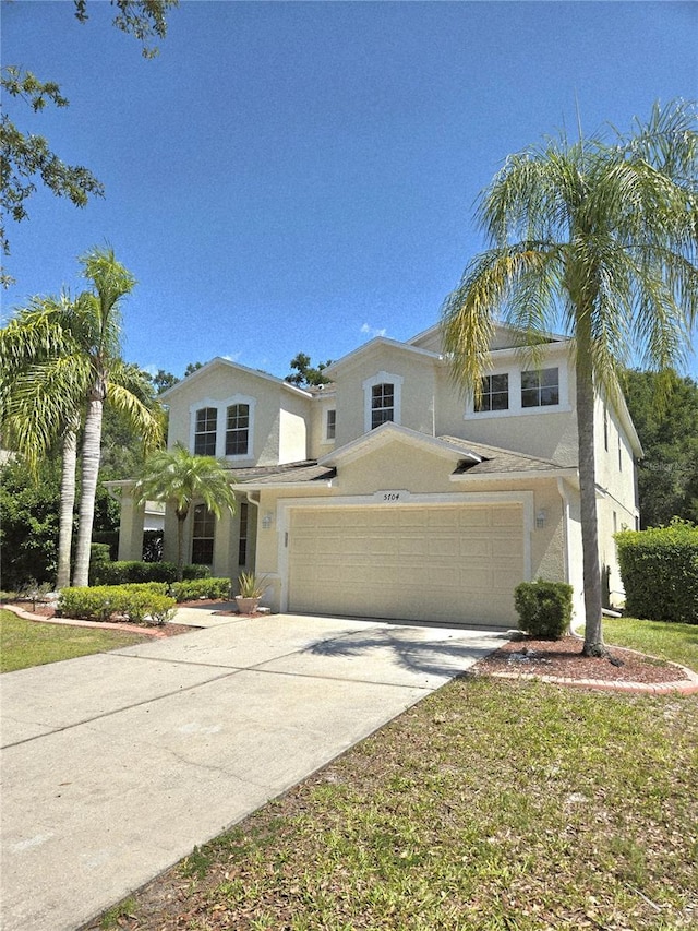 5704 Ansley Way, Mount Dora, FL 32757 - traditional home with stucco siding and concrete driveway